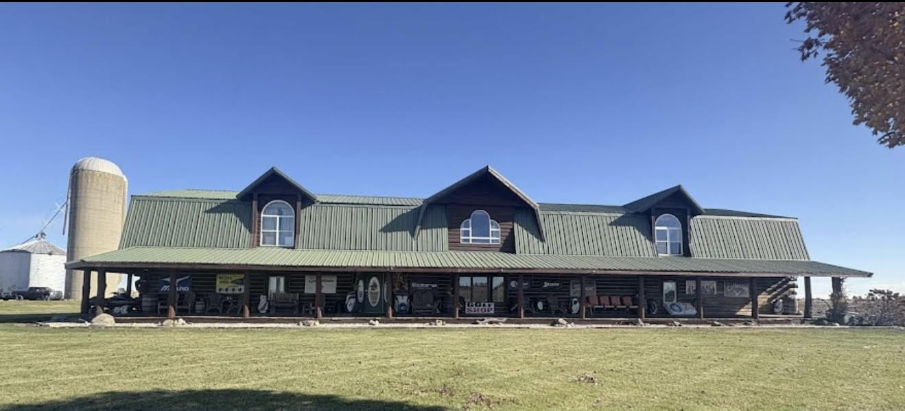 Sports Boss Golf storefront surrounded by open countryside in Leland, IL